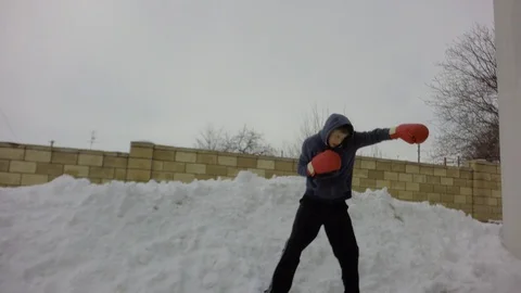 A fight with a shadow. Special boxing exercises in the winter. Stock-Footage 87739667