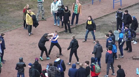 A fight teenagers on the street in the yard. 4K. Stock Footage 59291870
