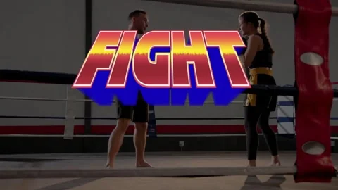 FIGHT title exploding, trainer and trainee sparring, woman throwing strikes for Stock Footage 331123636