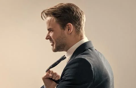 Fight at workplace. Manager being pulled by necktie. Physical fight. Conflict at Stock Photos