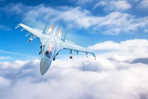 Fighter with acceleration and fire from engines flying above the clouds. 스톡 사진