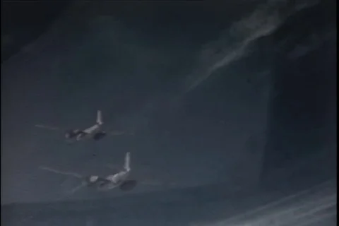 Fighter aircraft flying in flight - 1945 Stock Footage 104649377