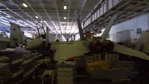 Fighter aircrafts and components inside the USS Carl Vinson Stock Footage 117713366
