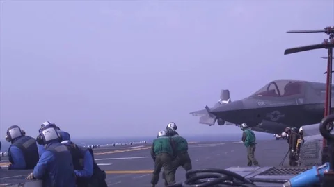 Fighter-bomber F-35, rapidly picking up speed and takes off Stock Footage 120950144