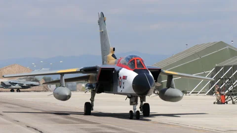 Fighter bomber jet in special color livery taxiing to the parking. Frontal view Stock Footage 222133007