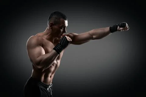 Fighter boxer on black background Stock Photos