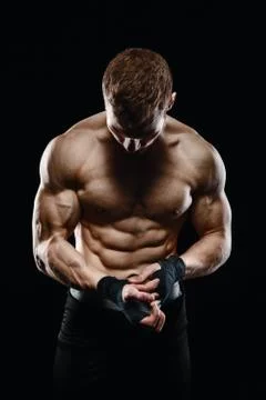 Fighter boxer standing staring strong on black background. Stock Photos