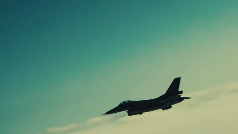 The fighter is descending over the clouds Stock Footage 123076319