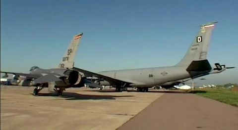 Fighter F-16 Fighting Falcon and Kc-135 refueling aircraftat parking lot Stock Footage 195487655