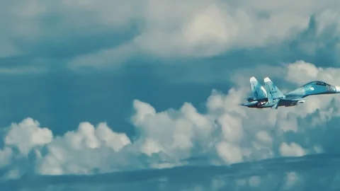 The fighter is floating above the clouds Stock Footage 123071660