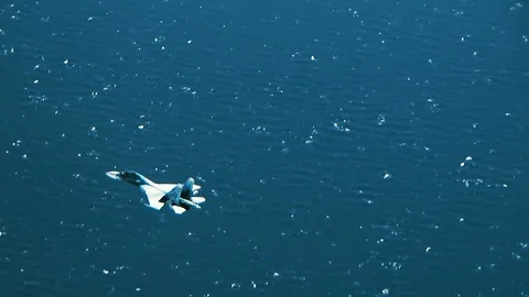 The fighter is flying over the waves Video stock 123120017