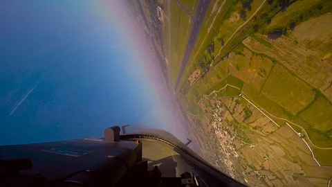 Fighter jet 360 degree rotation and low passing in the sky,deep ground Stock Footage 100516337