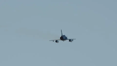 Fighter Jet with Afterburner Flies Away Stock Footage 334507318