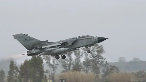 Fighter jet airplane of NATO in grey camouflage take off Stock Footage 179015916
