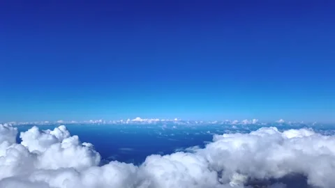 Fighter Jet Cockpit View Flying at Supersonic Spped Above Some Cottony Clouds Stock Footage 321794661