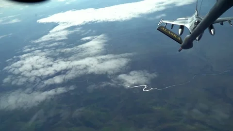 Fighter jet docking during refueling operations Stock Footage 131887814
