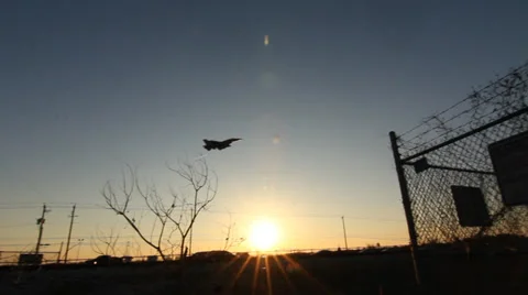 Fighter Jet Flies Overhead and Lands at Airforce Base Stock Footage 35111372