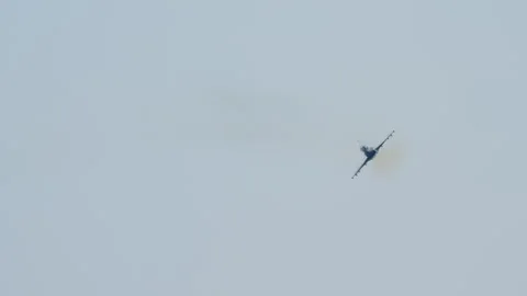 Fighter jet flying away with wing pylons 스톡 동영상 346179688