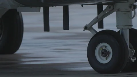 Fighter jet landing gear rolling on runway Stock Footage 324141987