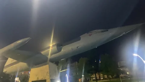 Fighter Jet Model at Night with City Lights Stock-Footage 347801449
