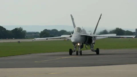 Fighter jet moving down runway towards camera Stock Footage 41368177
