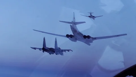 Fighter jet near the two bombers Stock Footage 123486563
