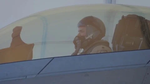 Fighter jet pilot opening the canopy and waving his hand - 2017 Stock Footage