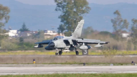 Fighter Jet slows down with spoilers and thrust reversers open after landing Stock Footage 155080018