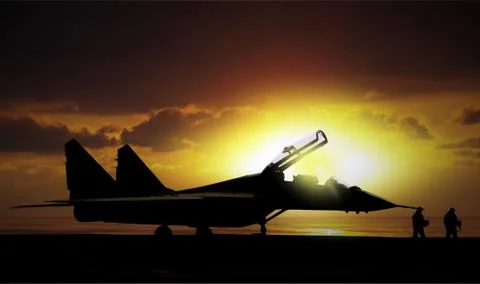 Fighter jet under sunset on super carrier at sea Stock-Fotos