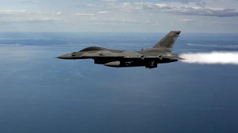 Fighter Jet With Vapor Trail Flying Over The Ocean Stock Footage 58456360