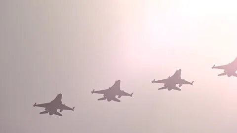 Fighter jets from air force flying close formation reflecting sunlight prepare 스톡 동영상 291271045