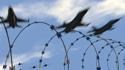 Fighter jets fly over barbed wire Vídeo Stock 172051944