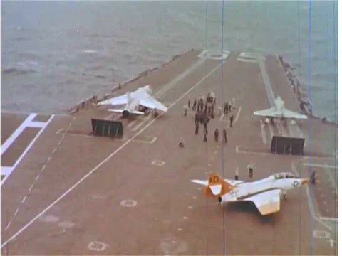Fighter jets take off from the deck of the USS Enterprise during the 1960s, Stock Footage 74947643