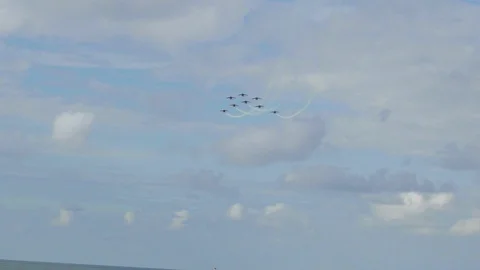 Fighter jets with white smoke flying in the blue sky during the summer in the Видео 107815077