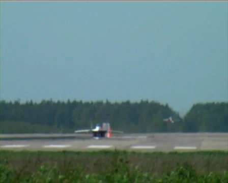 Fighter landing with parachute Stock Footage 1006619