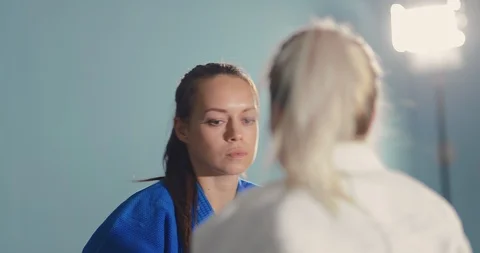 Fighter makes a capture with a throw. Fight girls on the tatami. Portrait view. 스톡 동영상 116834608