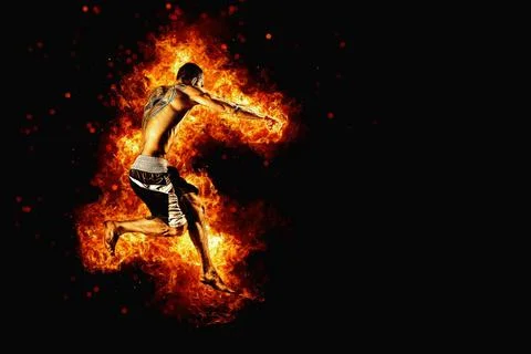 Fighter man punching in fire. MMA fighter Stock Photos