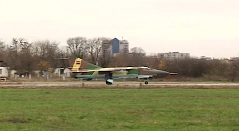 Fighter MiG-23 (NATO: Flogger) moves along taxiway. Close-up. Syrian Air Force Stock Footage 144254611