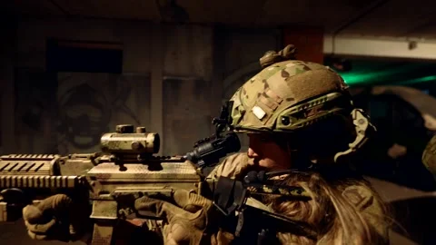 A fighter in night gear, preparing for an assault, the details of the equipment  Stock Footage 301301087