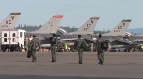 Fighter pilots walk to their aircraft at Red Flag Alaska Stock Footage 32579343