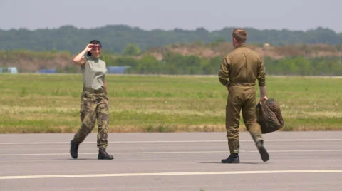 Fighter Pilots walking on tarmac Stock Footage 67338907