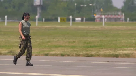 Fighter Pilots walking on tarmac Stock Footage 67338977