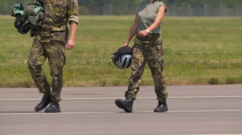 Fighter Pilots walking on tarmac Stock Footage 67338989