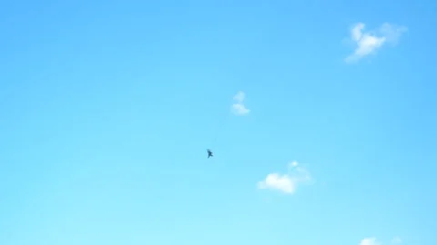A fighter plane flies in the sky. Selective focus. Stock Footage 256432456