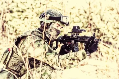 The fighter of a special unit performs a dangerous mission Stock Photos