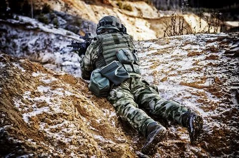 The fighter of a special unit performs a dangerous mission Stock Photos