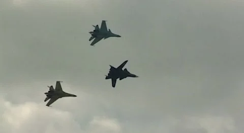 Fighter Su-47 Berkut, Su-30SM, Su-35 perform aerobatics with climb. Close-up. Stock Footage 182906058