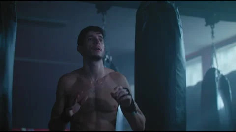 Fighter throwing medicine ball in boxing gym Stock Footage 275088455
