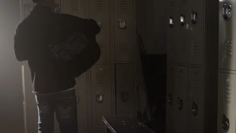 Fighter walks into gym changing room with big dufffle bag 스톡 동영상 104535035