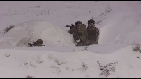 Fighters hide behind snow-capped hills and shoot at targets. Stock Footage 325566592